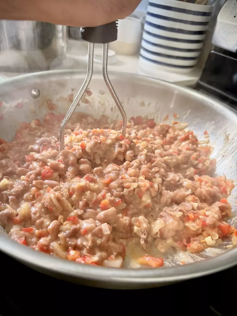 Mashing pinto beans